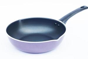 Purple frying pan on a white background photo