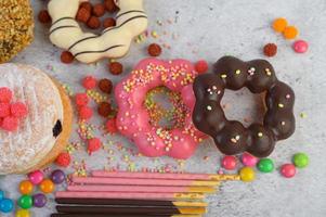 Decorative donuts on gray background photo