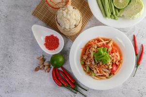 Thai papaya salad with ingredients photo
