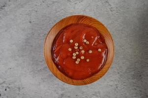 Tomato sauce sprinkled with pepper seeds