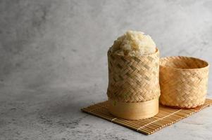 Thai sticky rice in a woven bamboo basket photo