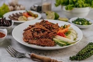 Pork liver salad with side dishes photo