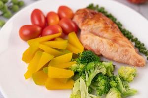 Grilled chicken steak and vegetables photo