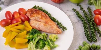 Grilled chicken steak and vegetables photo