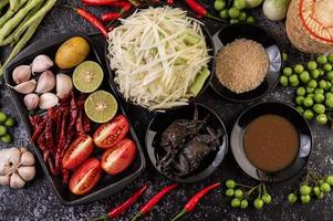 Papaya salad ingredients with fermented fish photo