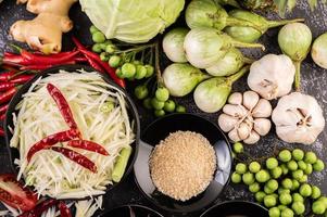 Papaya salad ingredients with fermented fish photo