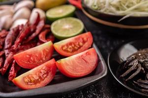 Papaya salad ingredients with fermented fish photo