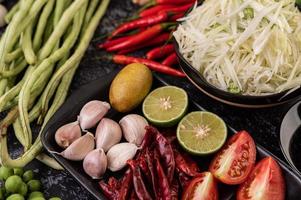 Papaya salad ingredients with fermented fish photo