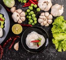 Rice noodles with beans, tomatoes, melon and chilies photo