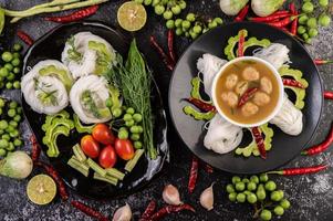 Rice noodles with chilies, melon, lentils and lemon photo