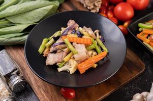 Stir fry vegetables with pork belly photo