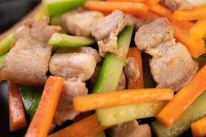 Stir fry vegetables with pork belly photo