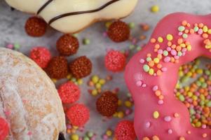 Toppings and strawberry donuts photo