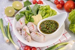 Stuffed squid with sauce and pork photo
