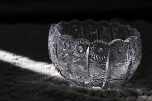 A crystal bowl is illuminated by sunbeam photo