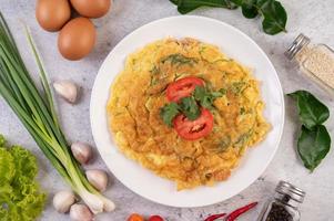 Egg omelet on a white plate photo