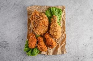Crispy fried chicken sprinkled with pepper photo
