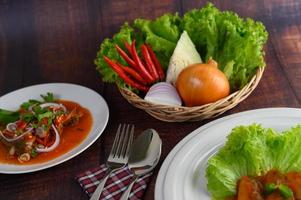 White plates with spicy sardine salad photo