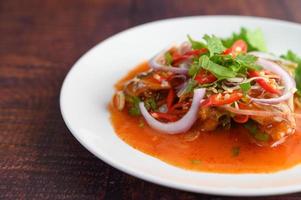 Spicy sardine salad with dressing photo