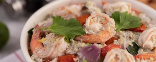 Shrimp salad in a white bowl photo