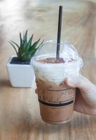 Person holding a frappe photo