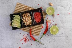 Ingredient of papaya salad on bamboo photo