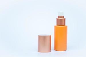 Yellow cosmetic bottle with a lid photo