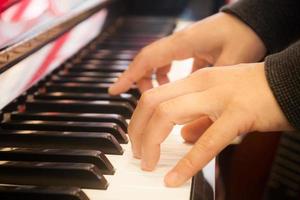 Hands on a piano photo