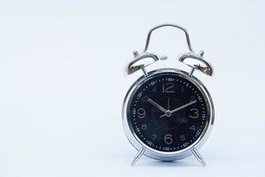 Alarm clock on a white background photo