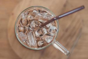 Top view of an iced coffee with a straw photo