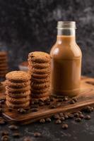 Cookies with coffee beans and milk photo