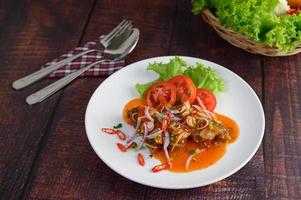 Spicy salad with sardines in tomato sauce photo