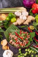 Stir-fried pork basil on banana leaves photo