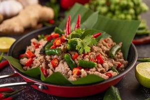 Stir-fried pork basil on banana leaves photo