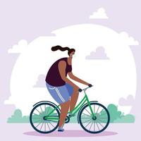 young African woman wearing medical mask in bicycle vector
