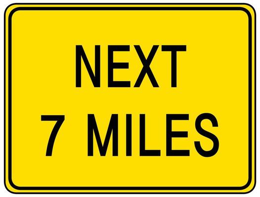 Next 7 miles sign isolated on white background