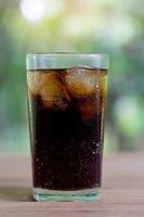 Glass of soda on a table photo