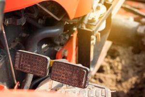 Brake and accelerator pedals for a tractor photo