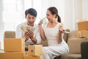 Happy couple at home office with online business