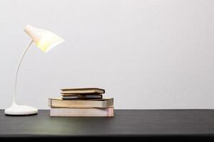 A stack of books on a table photo