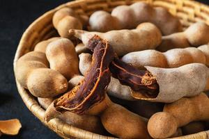 Tamarind in a wooden basket photo