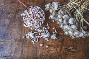 Garlic and cloves on a table photo