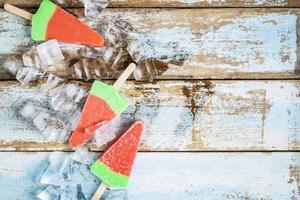 Ice cream sticks on a wooden table photo