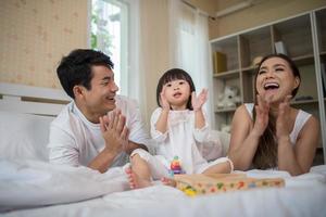 Happy child with parents playing