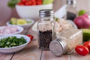 Pepper and sesame seeds shakers photo