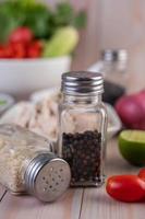 Pepper and sesame seeds shakers photo