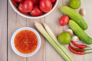 Cucumber, lemon, tomato, garlic, and chili with sauce photo