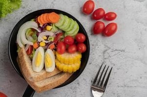 Vegetable salad with bread and boiled eggs photo