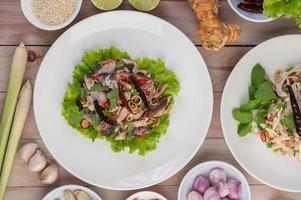 Deep-fried mackerel topped with pepper and mint photo