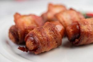 Sausage-wrapped pork belly photo